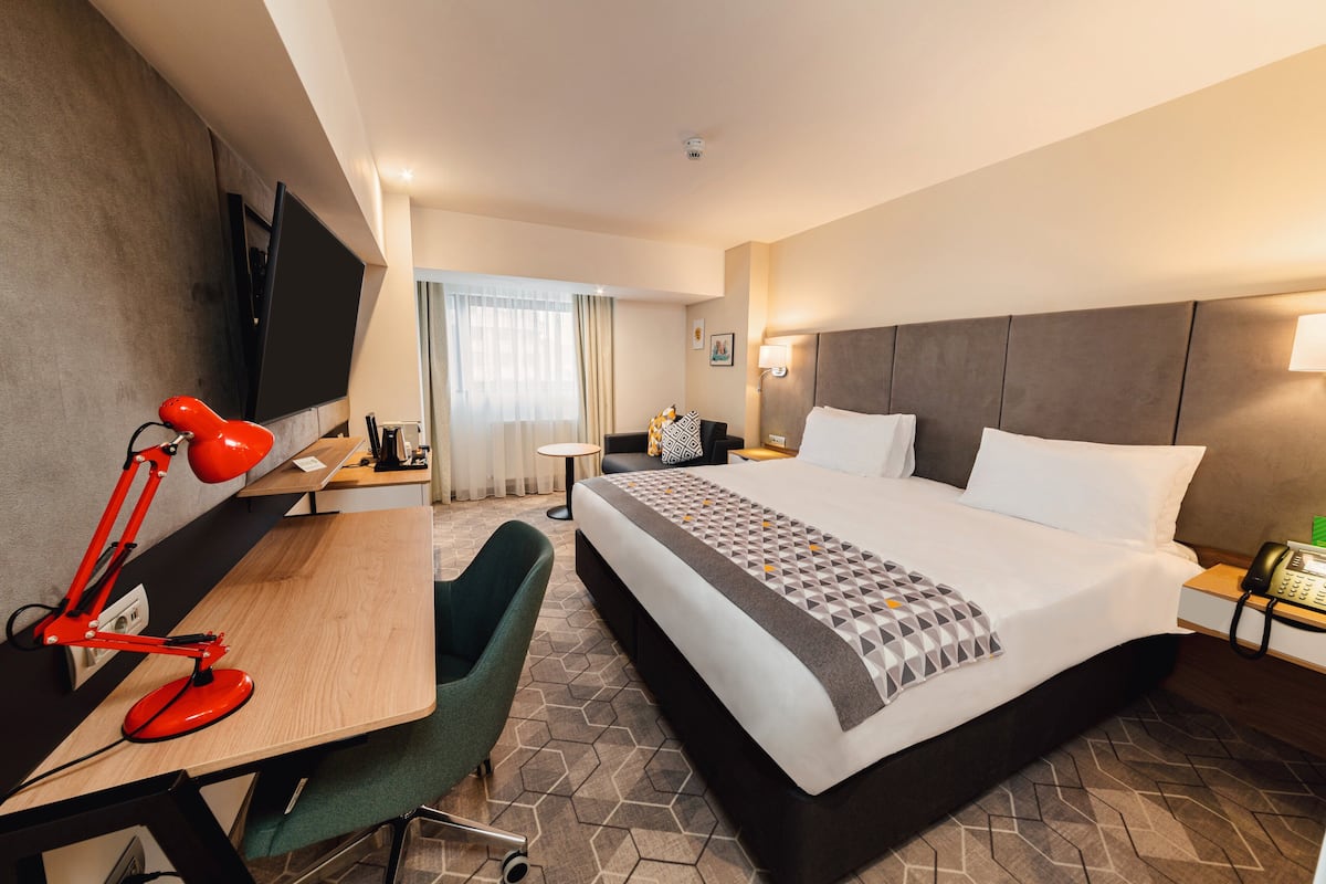 premium room, 1 king bed with sofa bed, city view | in-room safe, desk, laptop workspace, blackout curtains