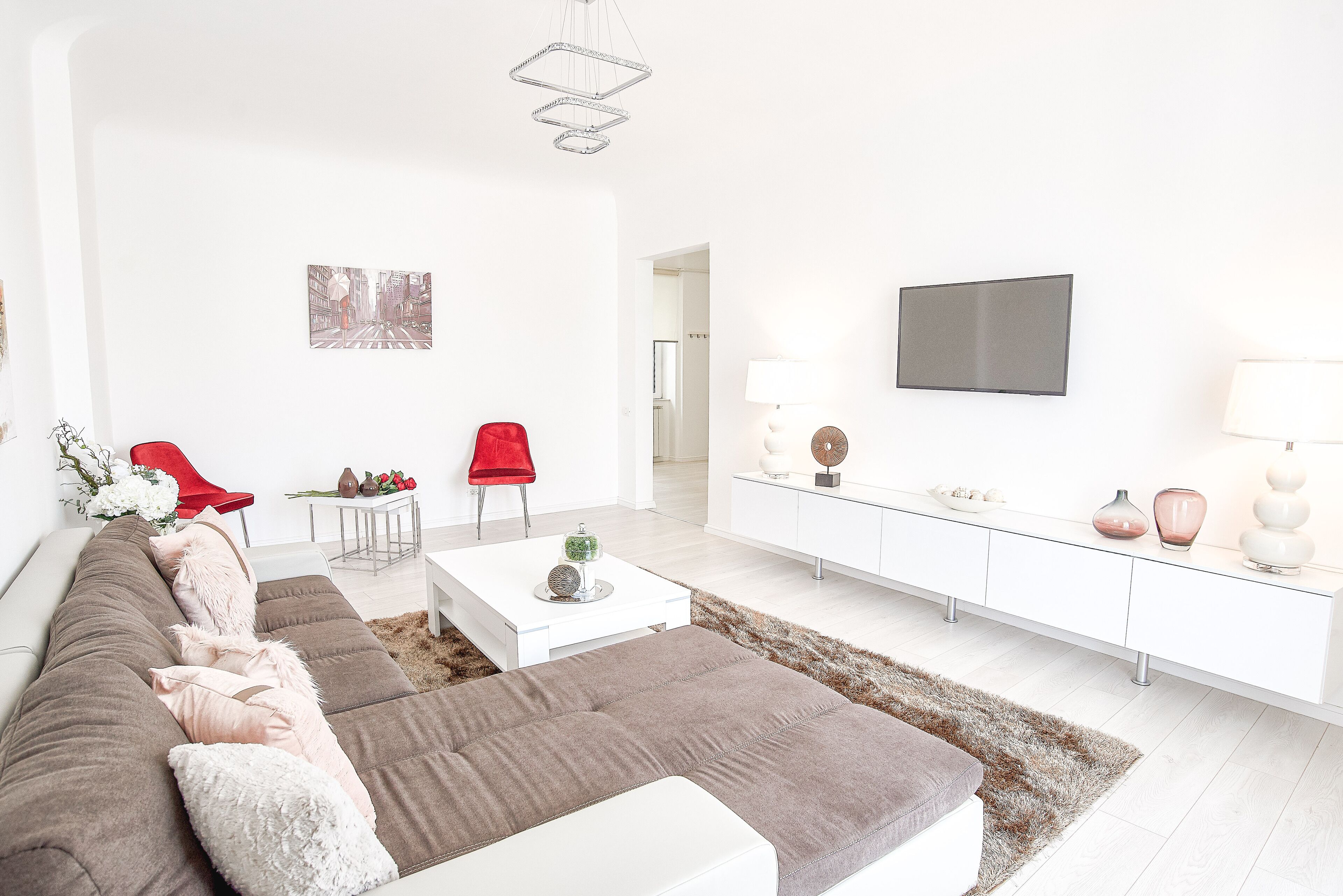 Appartamento Deluxe, vista città | Area soggiorno | TV a schermo piatto