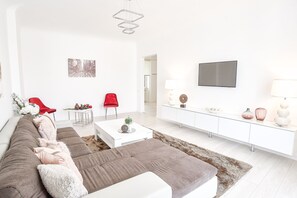 Deluxe Apartment, City View | Living area | Flat-screen TV
