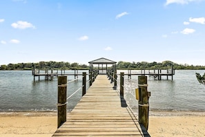 Stroll along the pier to a serene covered seating area overlooking the water.