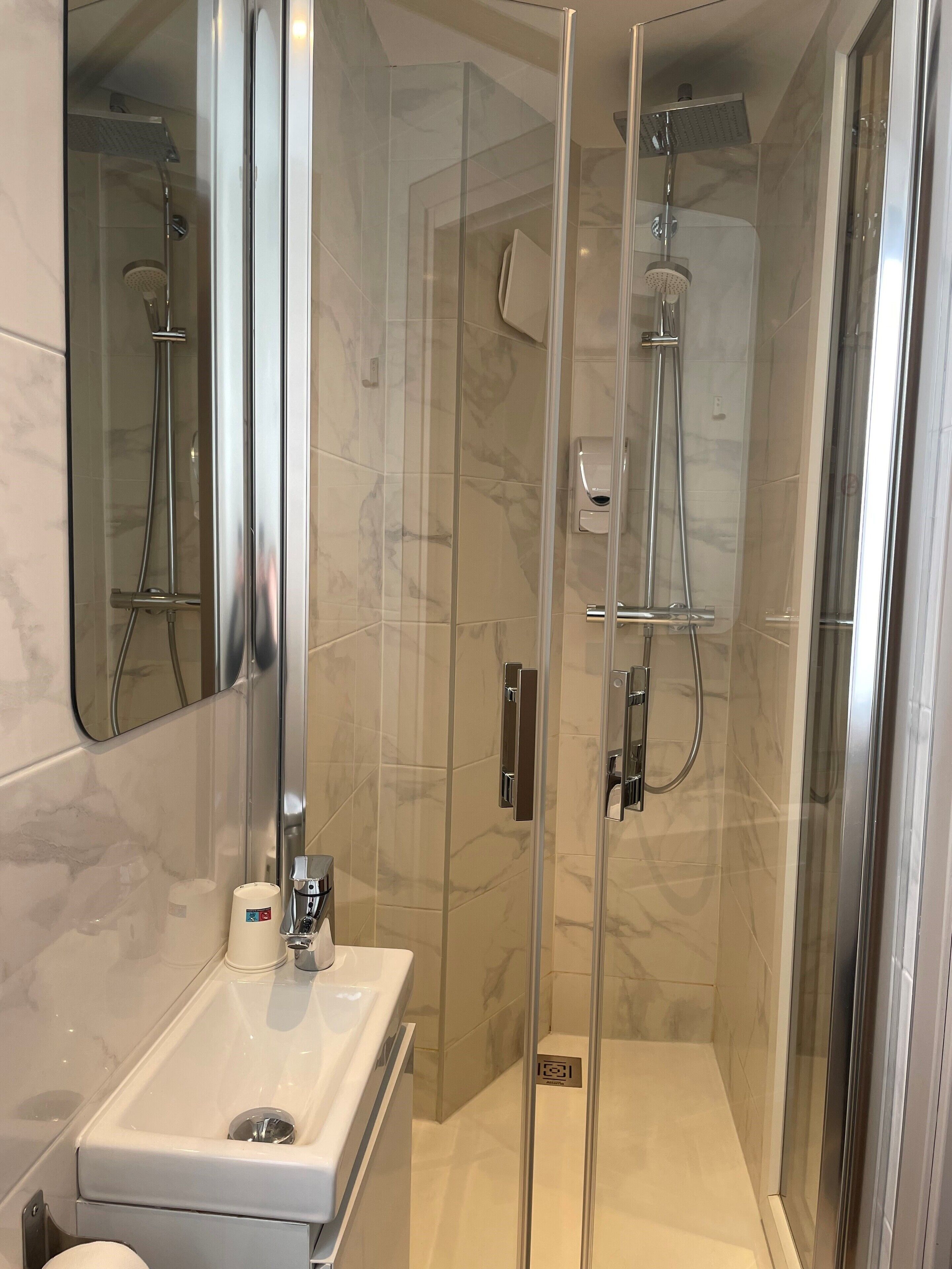 shower, eco-friendly toiletries, hair dryer, towels