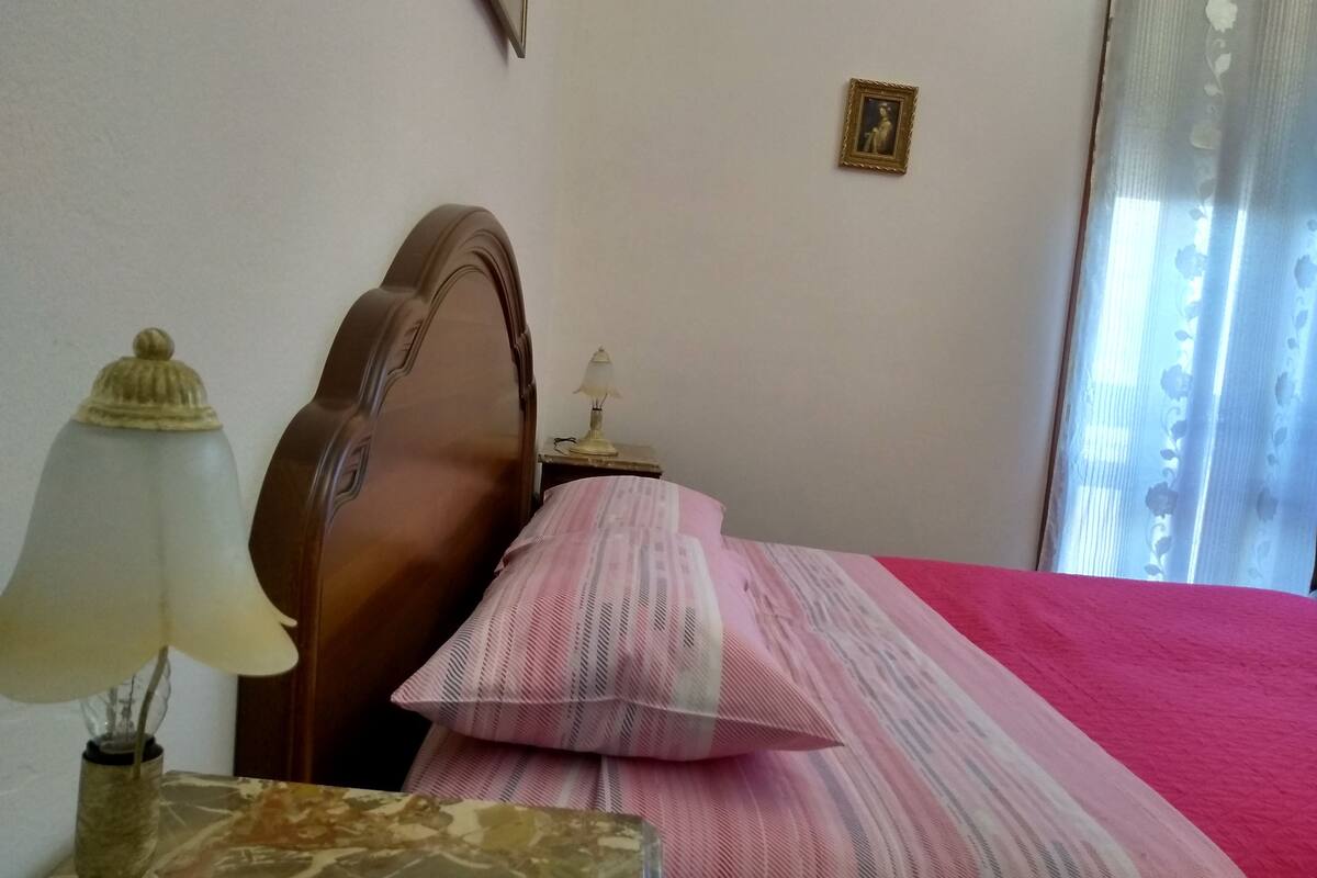 Premium bedding, desk, laptop workspace, blackout curtains