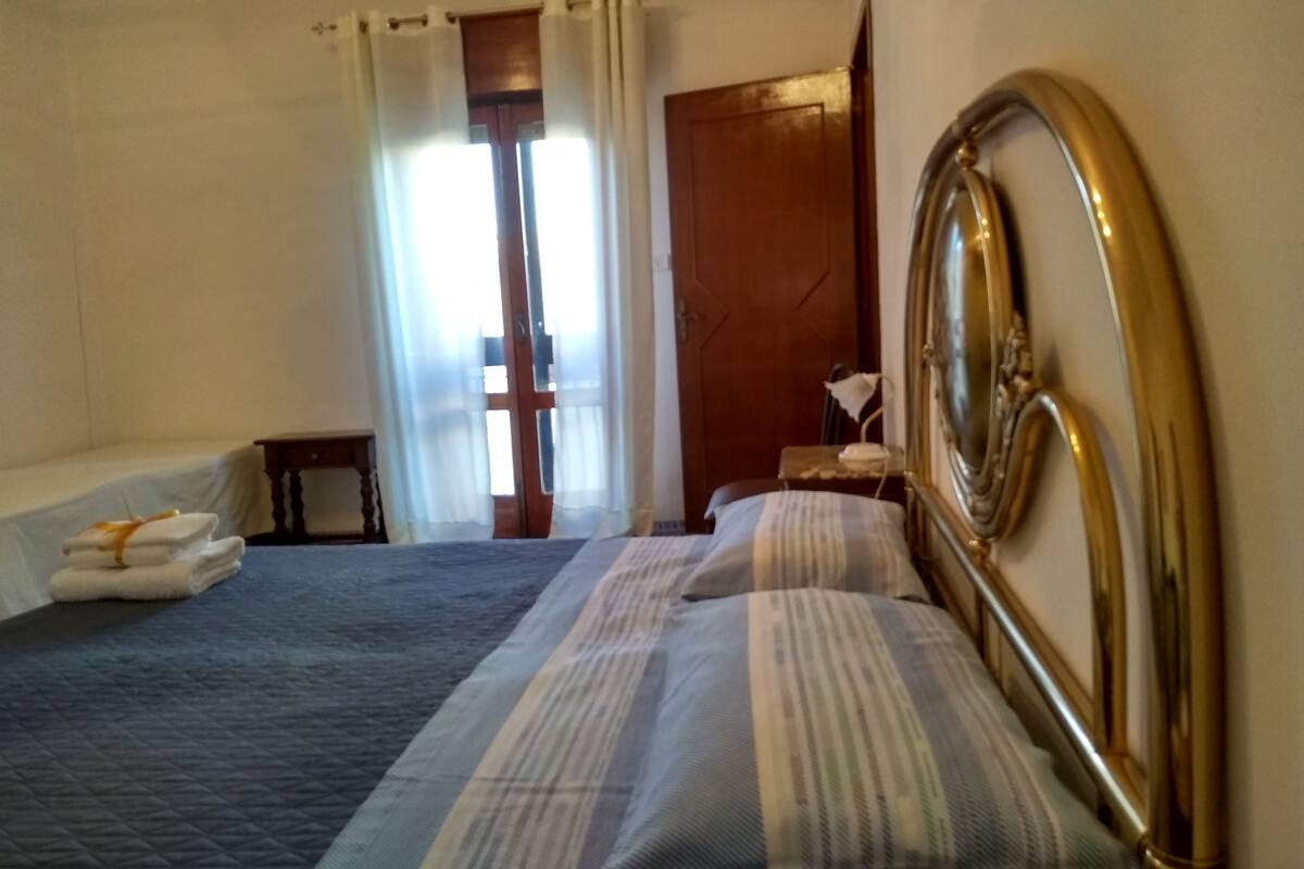 Premium bedding, desk, laptop workspace, blackout curtains