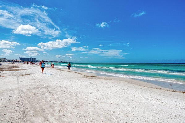 On the beach, sun loungers, beach towels