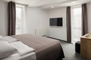 Habitación Business con 1 cama doble o 2 individuales | Caja fuerte, escritorio, sistema de insonorización y wifi gratis