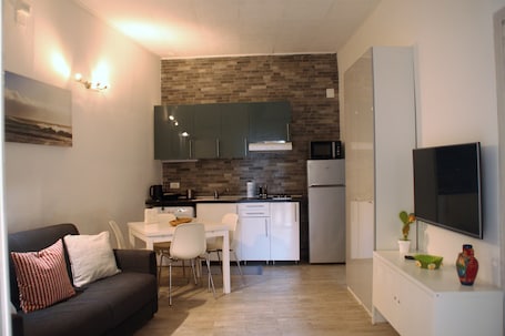 Comfort Apartment, 2 Bedrooms, Kitchen | Living area | Flat-screen TV