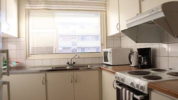 Apartment, 2 Bedrooms, Balcony (With Kitchen) | Private kitchen | Full-size fridge, microwave, oven, stovetop