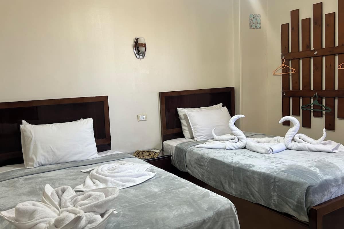 1 bedroom, premium bedding, blackout curtains, iron/ironing board