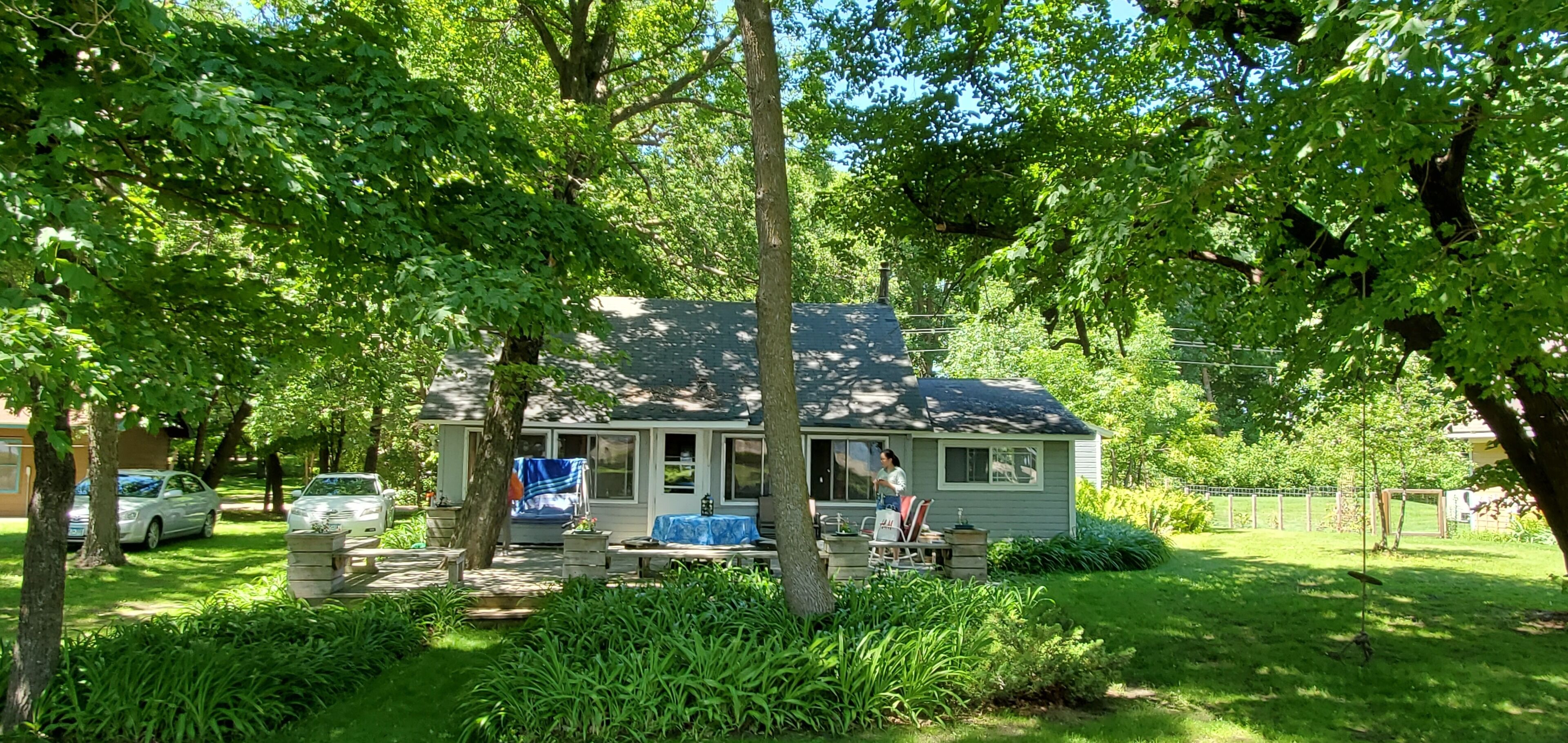 Large shaded yard, great for yard games.  Swingset and rope swing, private drive