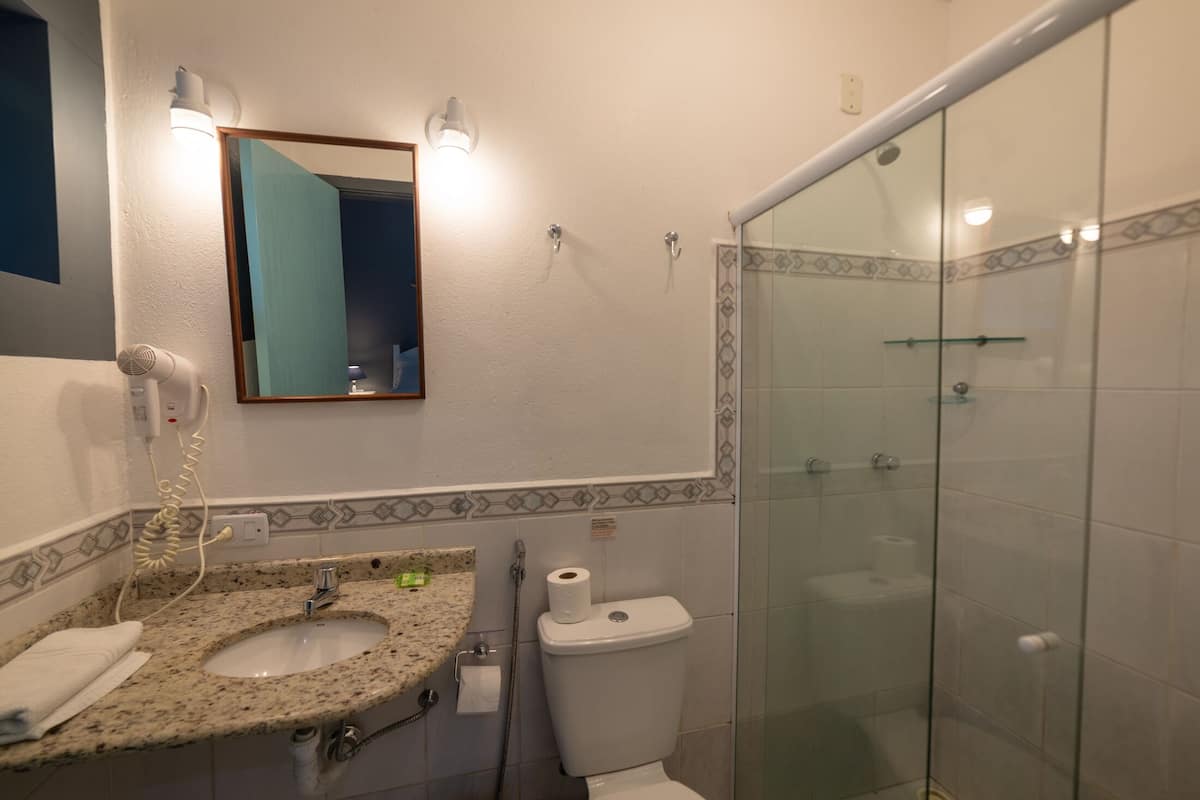 standard double room | bathroom | shower, hair dryer, towels