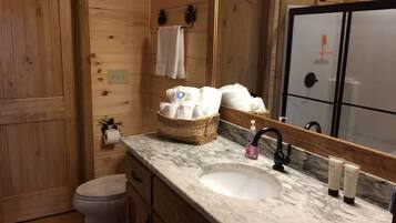 Combined shower/tub, towels, soap, toilet paper