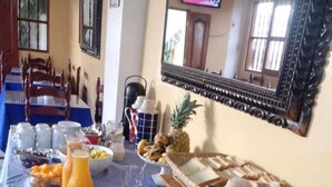 A breakfast buffet with various food items and beverages. - Hotel Santa Rosa (Ayacucho)