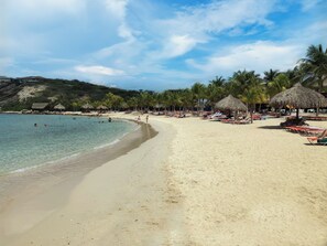 On the beach, sun-loungers, beach towels
