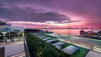 Outdoor pool, open 7:00 AM to 8:00 PM, pool loungers