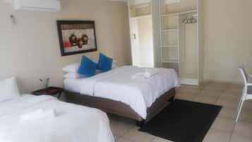 Premium bedding, memory foam beds, desk, laptop workspace