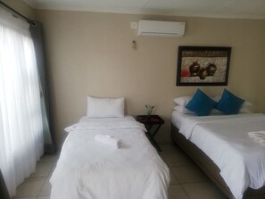 Premium bedding, memory-foam beds, desk, laptop workspace - BTV Guesthouse (Mbombela)