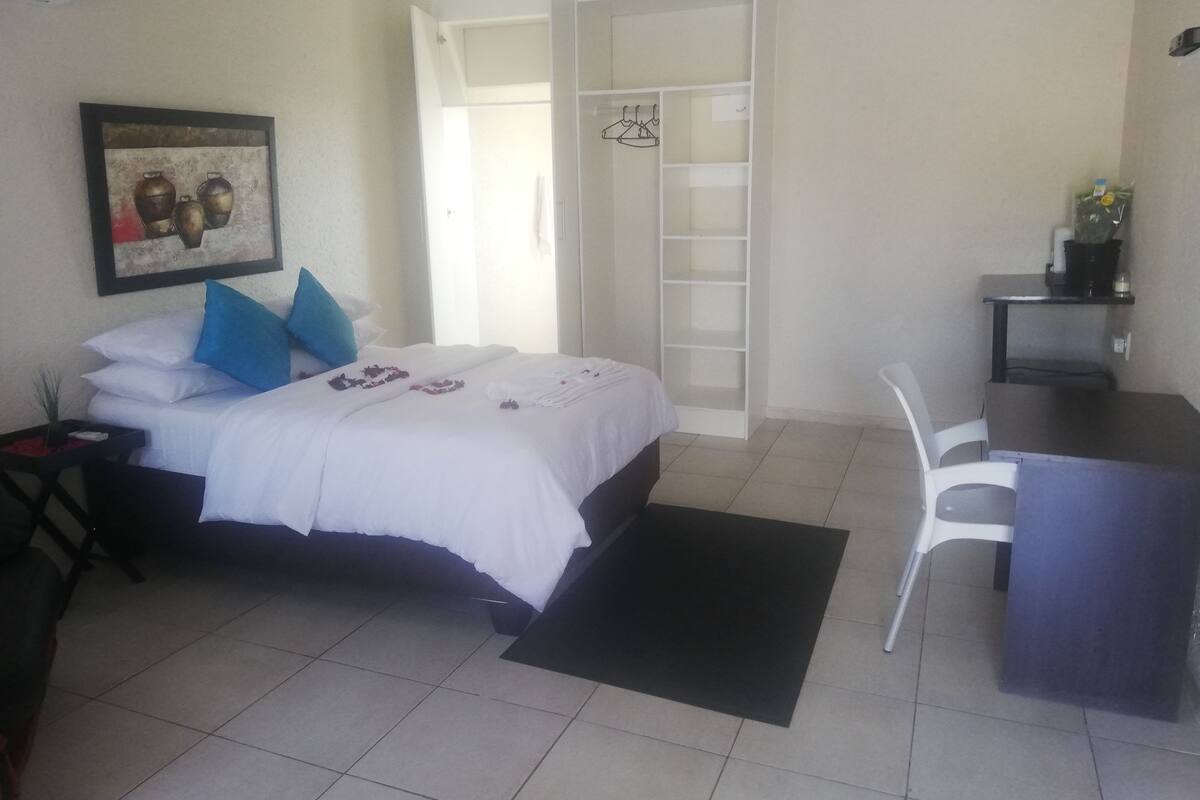 Premium bedding, memory foam beds, desk, laptop workspace