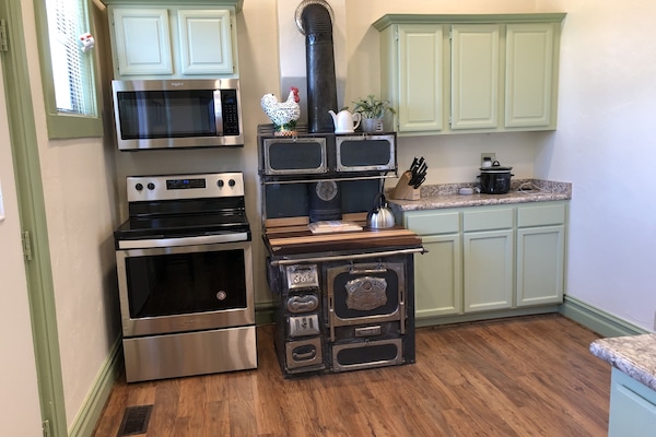 Cute food prep area with a repurposed wood stove.