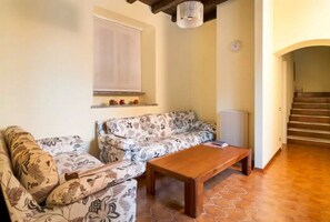 TV, fireplace, books, printers