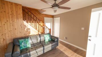 Family Quadruple Room, Lake View | Living area | 40-inch flat-screen TV with cable channels, TV