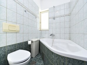 Bathtub, hair dryer, towels