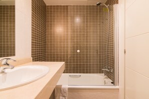 Bathtub, hair dryer, towels