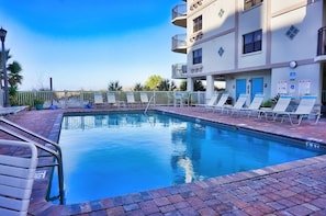 A heated pool - 🌅 Vista's on the Gulf #202 — Gulf Front Luxury with Balcony Views & Resort Amenities (St. Pete Beach)