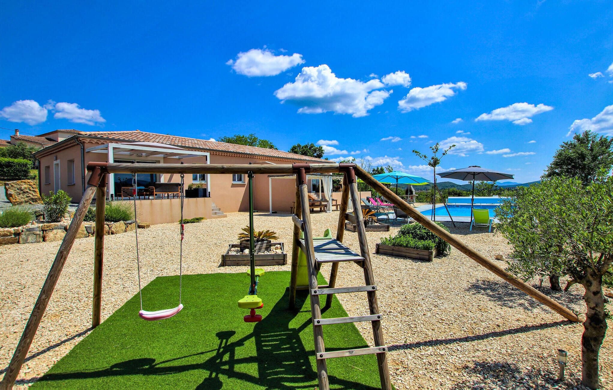A backyard with a swing set, a small pool, and a house with a patio.