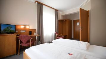 Desk, laptop workspace, blackout drapes, soundproofing