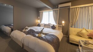 A hotel room with two beds, a sofa, a small table, and a window with curtains. - Framboise KYOTO Hotel de charme (Kyoto)
