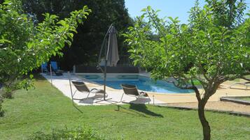 Seasonal outdoor pool, open 9:00 AM to 8:00 PM, pool umbrellas