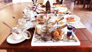 A buffet table with various food items and utensils. - Eidsvåg Fjordhotell (Molde)