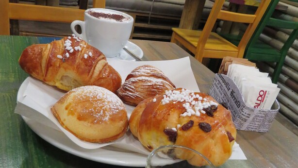 A table with pastries, a cup of coffee, and a glass of espresso. - L'arco e il vico (Naples)