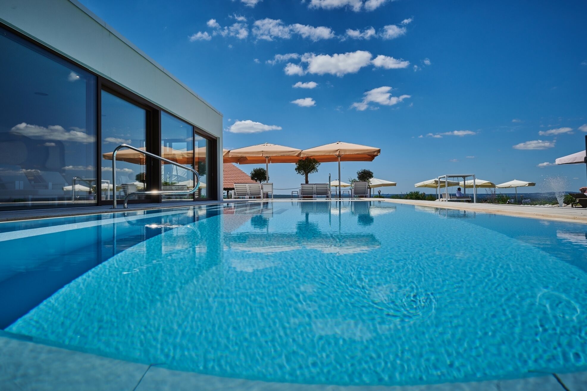 Indoor pool, outdoor pool, pool umbrellas, pool loungers