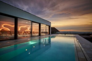 Indoor pool, outdoor pool, pool umbrellas, sun loungers