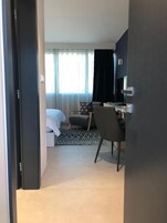 Desk, laptop workspace, blackout drapes, soundproofing