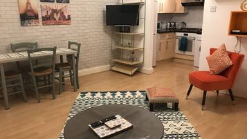 Apartamento, 1 cama de casal e sofá-cama | Área de estar