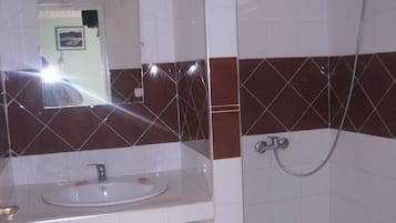 Shower, rainfall showerhead, hair dryer, towels