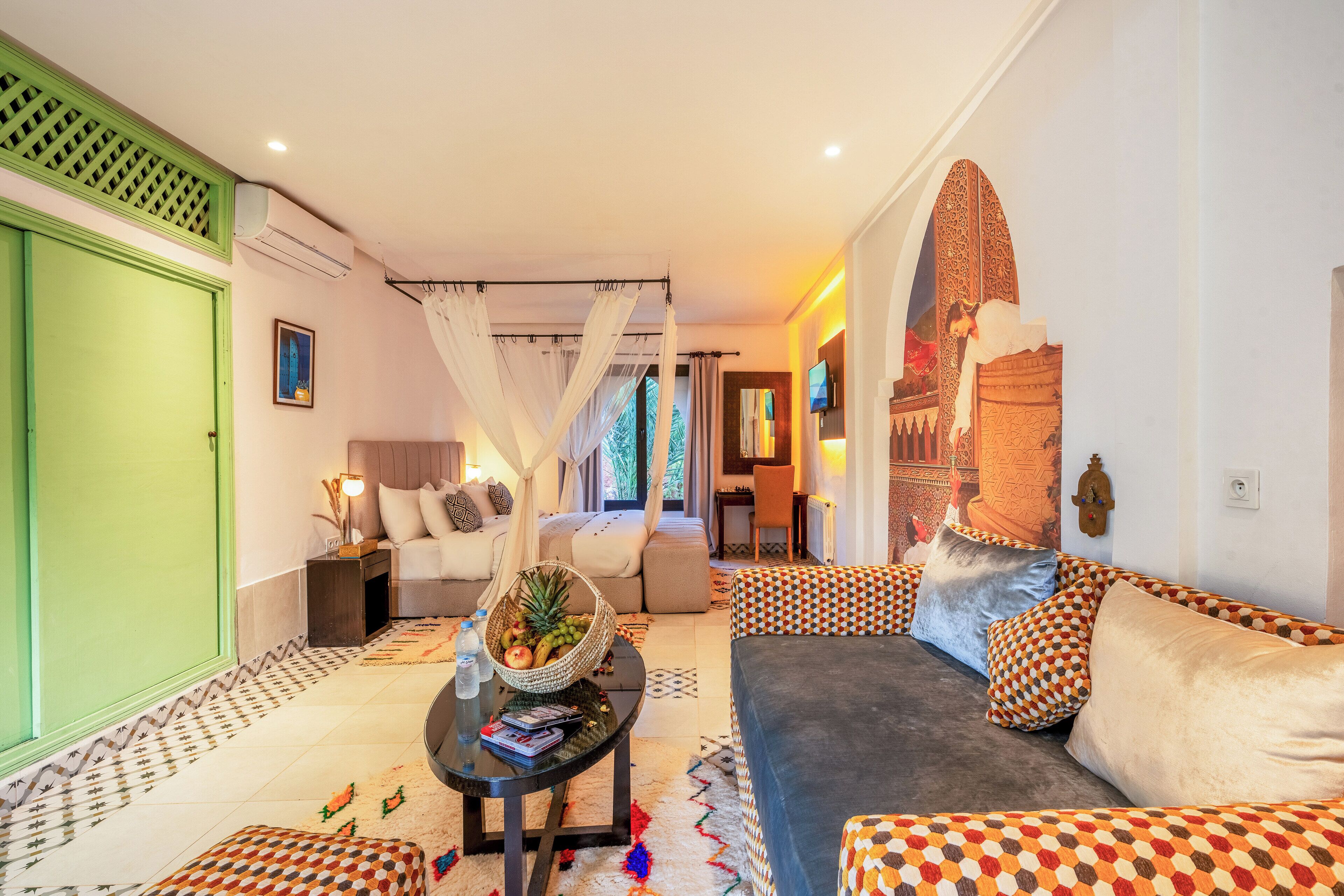 Deluxe King Suite | Minibar (free items), in-room safe, desk, blackout drapes
