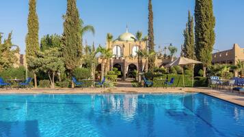 Outdoor pool, pool umbrellas, sun loungers