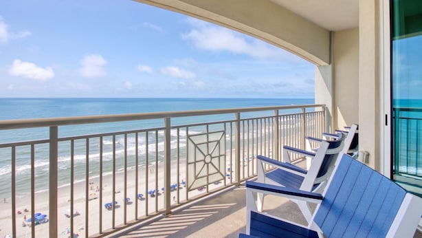 A balcony with a view of the beach and ocean. - MVG 1404 Oceanfront Corner Penthouse (North Myrtle Beach)