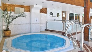 An indoor swimming pool with a tiled deck, a potted plant, and a 'Staff Only' sign. - 3 bedroom accommodation in Cromer (Cromer)
