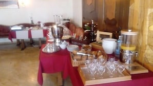 A dining area with a table set for a meal, including plates, glasses, and a variety of food items. - Gasthaus Hotel Anker (Konstanz)