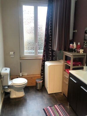 Bathtub, hair dryer, towels, soap