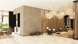 A modern living room with a large sectional sofa, a coffee table, and a dining area with chairs and a table. There are decorative lights hanging from the ceiling and a large window providing natural light. - Novotel Bur Dubai (Dubai)
