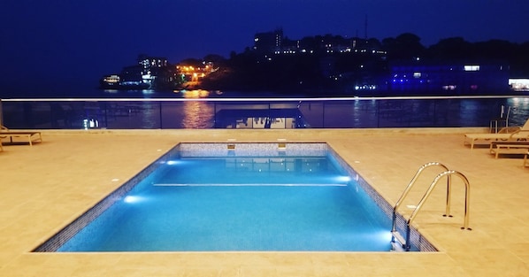 Outdoor pool, open 8:00 AM to 10:00 PM, sun loungers