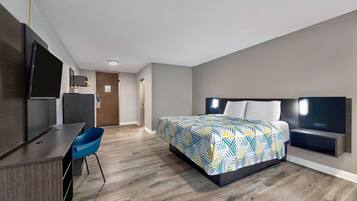 Premium bedding, desk, laptop workspace, blackout drapes