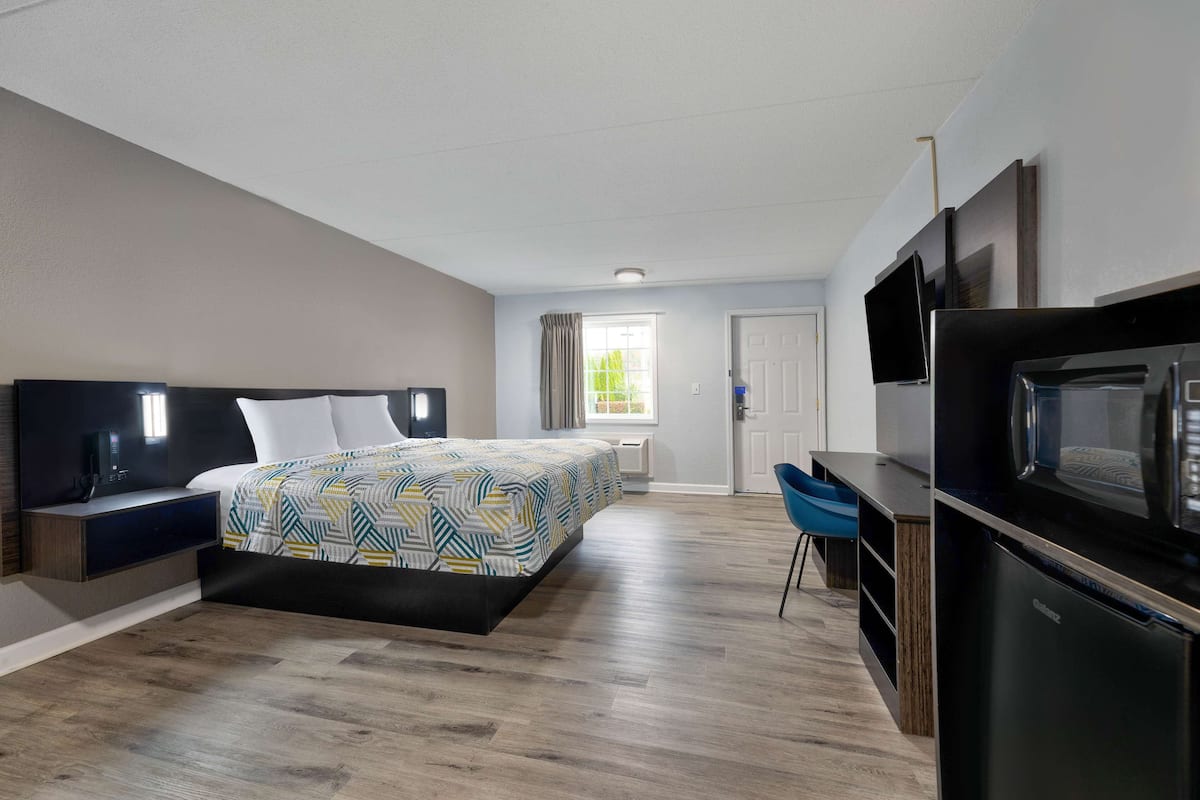 Premium bedding, desk, laptop workspace, blackout drapes