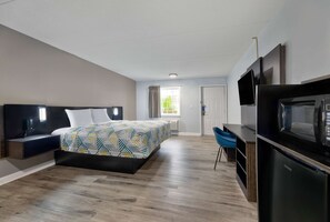 Premium bedding, desk, laptop workspace, blackout curtains