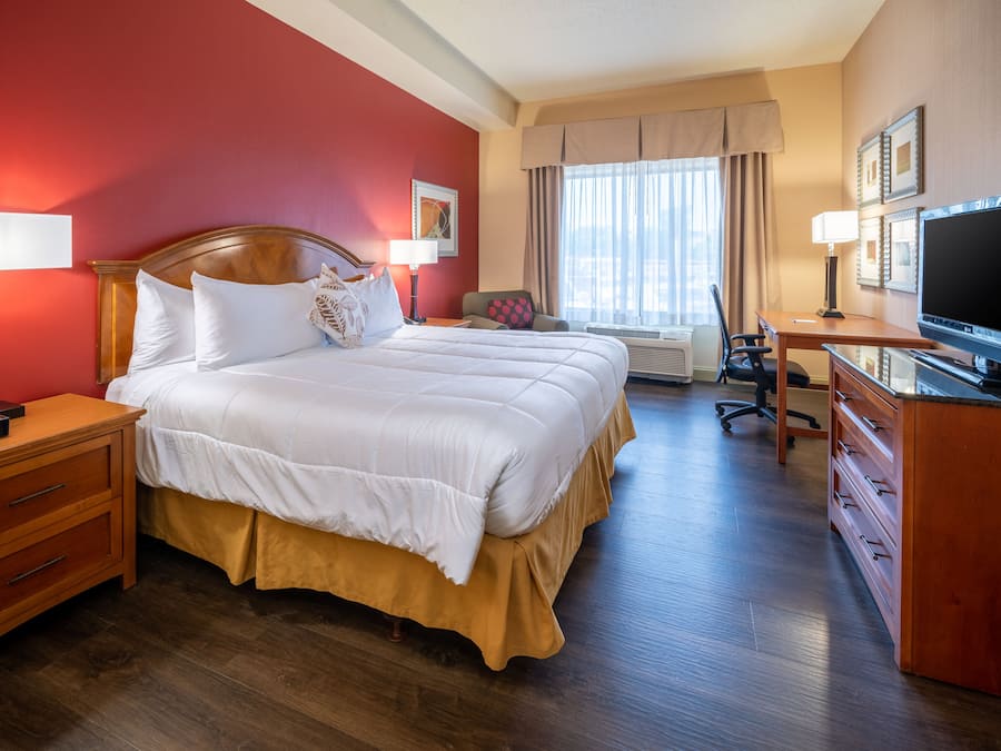 Premium bedding, desk, laptop workspace, blackout curtains